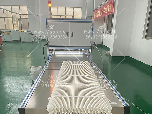 Filter cartridge production equipment